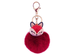 Detail of red rhinestone fox head keychain with a matching burgundy faux fur pompom
