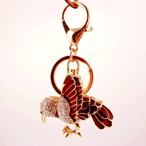 Creative rhinestone bird keychain with red enamel wings and golden lobster clasp