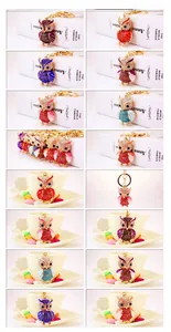 Detailed collection of colorful rhinestone owl keychains in various metallic finishes