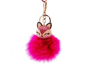 Detailed close-up of pink fox head pendant with rhinestones and faux fur pompom keychain