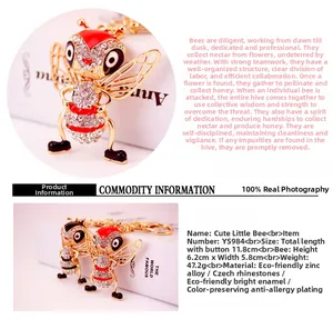 Detail showing dimensions of a sparkling crystal bee keychain with gold zinc alloy finish