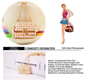Detail showing pearl mini handbag keychain measurements with gold alloy plating
