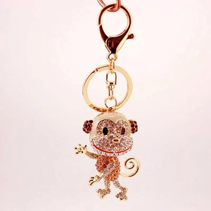 Sparkling rhinestone monkey keychain pendant with gold plating and crystal inlay