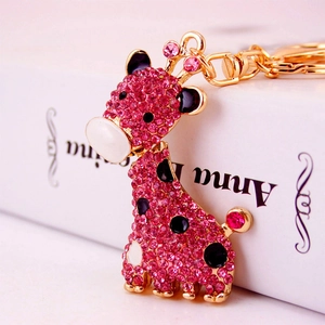 Porte-clés girafe en strass rose et métal doré avec détails en émail pour sacs