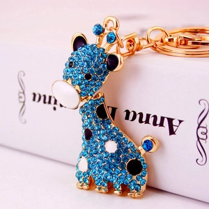 Porte-clés girafe en strass bleu scintillant avec base en métal doré et fermoir à ressort