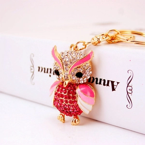 Exquisite owl keychain with pink rhinestones and enamel details on gold metal frame