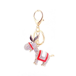 Sparkling rhinestone donkey keychain accessory with golden alloy and enamel detailing