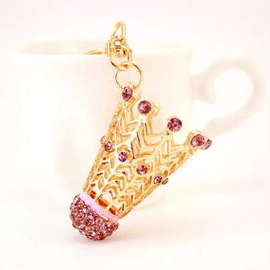 Porte-clés volant de badminton doré avec design couronne et strass roses brillants
