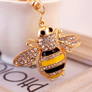 Sparkling crystal bee keychain with gold finish and enamel details for handbags