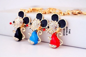 Detailed close-up of cartoon mouse keychains with sparkling rhinestones and colorful enamel
