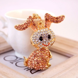 Sparkly bunny keychain with pink and white crystals on a golden metal rabbit pendant