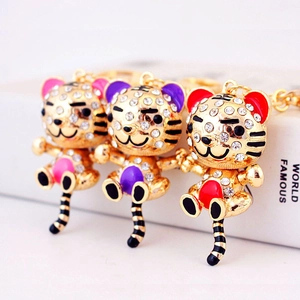 Porte-clés tigre du zodiaque doré avec strass en couleurs rose violet et rouge