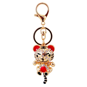 Porte-clés tigre mignon avec cristaux blancs et détails en émail rouge fini doré