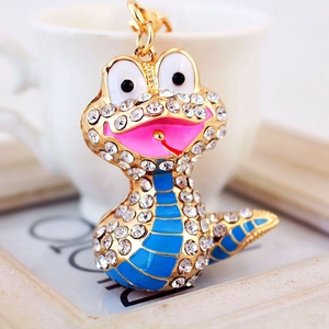 Porte-clés serpent avec strass blancs et émail bleu sur support métallique doré
