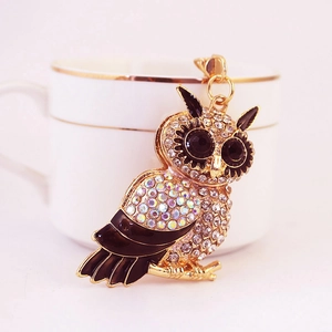 Sparkly owl keychain with colorful rhinestones and black enamel on a golden alloy base