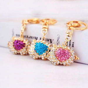 Sparkling pig keychain set with crystal rhinestones in purple blue and pink colors