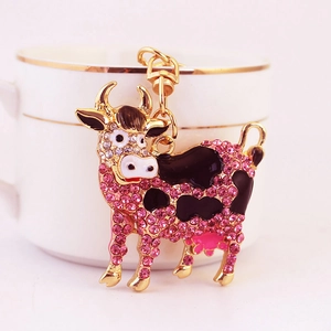 Portachiavi a forma di mucca con strass rosa e catenella in metallo dorato lucido