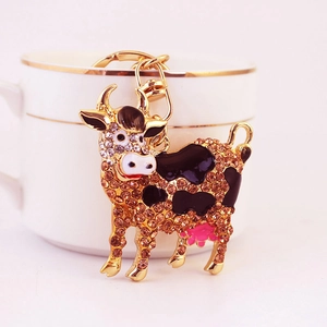 Portachiavi a forma di mucca con strass color champagne e gancio in oro lucido