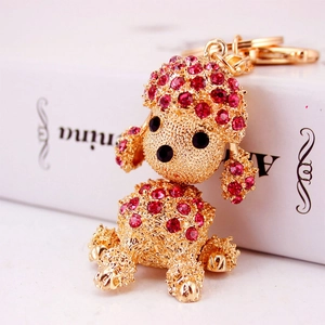 Sparkling pink rhinestone poodle dog keychain accessory in polished gold metal plating