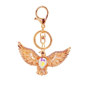 Vintage eagle keychain in rose gold with sparkling rhinestones and cat-eye stones