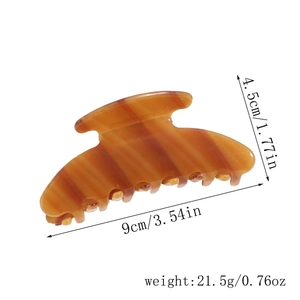 Detailed view of large amber acetate hair claw clip with size 9cm x 4.5cm and weight 21.5g