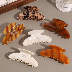 Elegant large acetic acid hair claws in various vintage amber and cream patterns