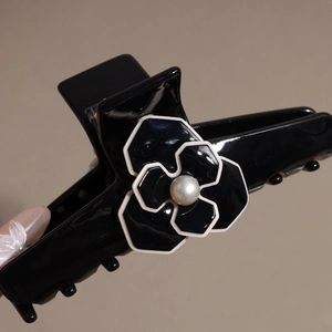 French style acetate camellia hair claw with pearl detail and glossy black finish