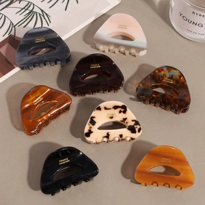 Set of 8 vintage acetate hollow triangle hair claws in tortoiseshell and marble patterns