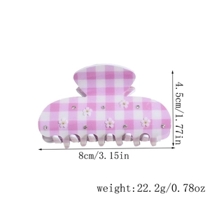 Detailed view of 8cm pink plaid hair claw clip with floral accents and measurements