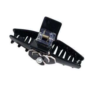 French camellia hair claw clip with black glossy finish and pearl accent for women