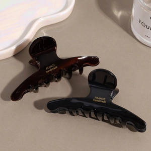 Elegant tortoise shell and black hair claw clips with gold handmade lettering detail