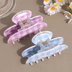 Sweet plaid hair claws with flower details and rhinestones in pink and blue colors