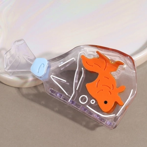 Detail of creative fish bag hair claw clip showing realistic orange goldfish in transparent acrylic