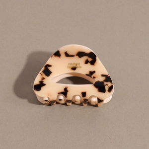 Close-up of tortoiseshell acetate hair claw clip with gold FRANCE Handmade inscription