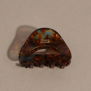 Detail of tortoise shell acetate claw clip with gold FRANCE Handmade text engraving