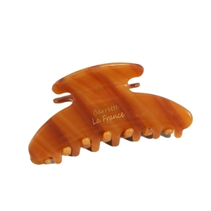 Elegant amber acetate hair claw clip with vintage marble pattern and gold lettering