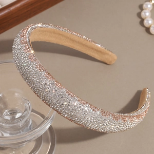 Macro shot of silver and rose gold rhinestone padded headband with crystal embellishments