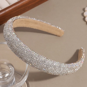 Macro view of high-density rhinestone headband with wide padded velvet inner band