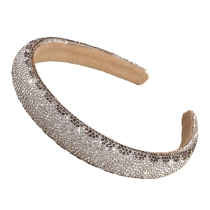 Sparkling padded headband with silver and black crystals on a khaki non-slip liner