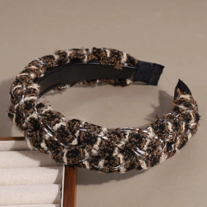 Detail view of the chunky tweed braided headband showing rich texture and anti-slip teeth