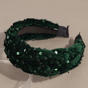 Detailed view of dark green velvet headband with sequins and non-slip inner grip