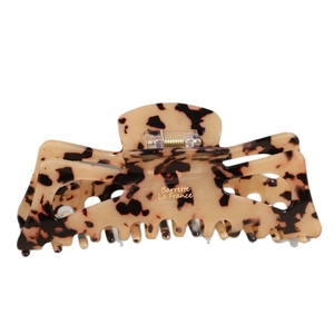 Classic leopard pattern hair claw clip with gold lettering for elegant hairstyling