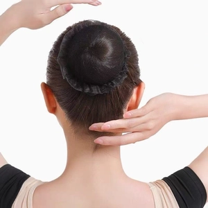 Detailed view of a black elastic lace hairnet worn on a bun, ideal for ballet and nursing