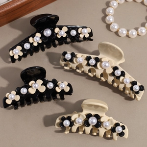 Elegant French flower and pearl hair claws in black and cream, set of four hair clips