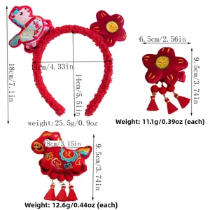 Detailed view of red plush hair accessory set with embroidery and tassels for New Year