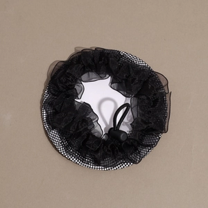 Detail view of black bun hair net with lace trim and adjustable elastic drawstring
