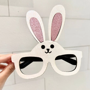 Detail view of Easter bunny glasses with white and pink glitter finish and cute rabbit face