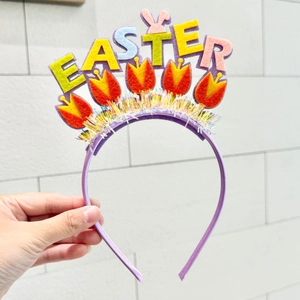 Detail of Easter headband featuring colorful felt letters and cute rabbit ears with tassels