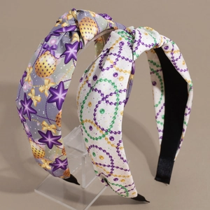 Set of two festive knotted wide headbands with colorful prints and satin finish