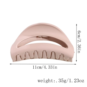 Detail view of pink matte hair claw clip showing 11cm length and 6cm height dimensions